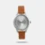Embrace sleek and chic style with this timepiece for women by Titan Neo featuring a silver dial, a round metal case, and a brown leather strap. Pair it effortlessly with a black sheath dress, silver hoop earrings, and black heels for a sophisticated and polished look. Let this watch be the epitome of timeless elegance in your ensemble.
