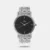 Embrace classic sophistication with this analog watch for men featuring a black round dial and a metal case. Elevate your everyday look by pairing it with a crisp white button-down shirt, charcoal grey blazer, and black leather loafers. Let this watch be the refined finishing touch to your ensemble.