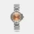 This analog watch for women from Titan Neo showcases a rose gold dial in a round metal case, exuding modern elegance. The metal strap, with a push-button clasp, provides a finished look. Suitable for various occasions, this water-resistant watch complements both casual and formal attire.