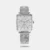 Infuse class to your attire with this women's analog watch from the Avant Garde collection by Titan. The white square dial is nestled in a 32 mm case. It exhibits plain three hands and a crown for time adjustment. The stainless steel bracelet exudes a silver hue that accentuates the look of the watch