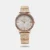 Carry great technology wrapped around your wrist with this stylish women's analog watch from Titan. The White MOP round dial is housed in a case. It exhibits and a crown for time adjustment. The stainless steel strap comes in a rose gold hue that further elevates the look of the timekeeper. Moreover, it is equipped with a deployment clasp to ensure a secure fit on the wrist