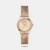 Own this women's analog watch from Timex and keep yourself updated with the latest trends. Its stainless steel strap flaunts a rose gold hue that accentuates the look of the watch. The rose gold round dial is protected by a mineral glass. It showcases plain three hands and a crown for time adjustment. Furthermore, it is complemented with a hook buckle clasp that ensures a secure fit on the wrist.