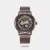 Discover this automatic wristwatch, featuring a round dial with a unique skeleton dial that reveals the internal workings. Securely fastened with a sliding buckle, its stainless steel mesh strap provides a sleek look. It has bar and Roman numeral hour markers and water resistance up to 30m.