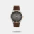 The Calvin Klein Men's Watch - 25200453 from the Ascend Collection combines sleek design with practicality. It features a round grey dial with an analog display, providing a sophisticated and timeless look. The watch is powered by quartz movement for reliable timekeeping. The brown leather strap adds a refined touch, making this timepiece perfect for both casual and formal occasions.