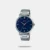 This is a round-shaped men's wristwatch made of stainless steel with a diameter of 46 mm and a blue dial. The watch has an analog display with a quartz movement and is water-resistant up to 3 ATM. The strap is also made of stainless steel with a folding clasp and a width of 21 mm.