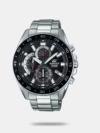 Elevate your watch game with this designer 53mm chronograph watch that comes with a round dial, functionality subdials, and a three-hand movement with stick indices. The watch also features water resistance up to 100 meters and a sturdy metal strap with a fold-over deployment clasp closure that ensures a secure fit.