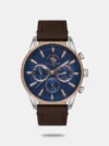Independent design meets exceptional functionality in this watch. The steel case features a balanced matte and smooth finish, enclosing a guilloche dial with a transparent window and the brand logo. Applied hour markers combine strokes and Roman numerals, while leaf-shaped feuille hands with luminescent coating ensure visibility in the dark after exposure to light. A fluted crown with protective detailing enhances durability. The comfortable leather strap and secure clasp complete the design with reliable craftsmanship.