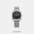 This sleek analog watch features a stainless steel mesh strap with a convenient sliding buckle for a secure fit. The round dial showcases minimalist dot hour markers for a stylish yet simple design. With a 30m water resistance, it’s built to handle daily wear easily.