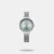 This sleek analog watch features a stainless steel mesh strap with a convenient sliding buckle for a secure fit. The round dial showcases minimalist dot hour markers for a stylish yet simple design. With a 30m water resistance, it’s built to handle daily wear easily.