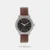 Accessorize your look with this analog watch featuring a round dial with bar hour markers, 50m water resistance, and a leather strap with a tang buckle closure.