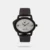 This analog watch for girls contains a silver, oval dial, housed in a Metal case that has a crown attached. Three plain hands, along with two Arabic numeral markings are present on the dial. Its purple strap, made of leather, has an adjustable metal buckle closure.