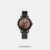 Own this women's analog watch from the Animal Print collection by Fastrack and keep yourself updated with the latest trends. Its stainless steel strap flaunts a stunning black hue that accentuates the look of the watch. The rose gold round dial is protected by a mineral glass. It showcases plain three hands and a crown for time adjustment. Furthermore, it is complemented with a hook buckle clasp that ensures a secure fit on the wrist.