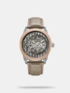Combining technical mastery with bold design, this watch is powered by a seamless automatic movement for precise timekeeping. Its curved glass enhances the dynamic profile, while the stunning skeleton dial reveals the intricate inner workings of the self-winding mechanism. The brand detail at 12 o'clock reinforces its style, while the features like a 50m water resistance, round dial, and a two-tone metal bracelet strap with a push-button deployant clasp enhance the functionality.
