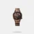 Embrace organized sophistication with the Fastrack Exuberant analog watch. The intricate brown dial features textured subdials displaying the day, date, and a 24-hour format, accented with gold tones, defining the modern functionality of this watch. Its sleek rose gold stainless steel strap amplifies the confident, monochromatic aesthetic. This timepiece offers a dynamic and practical look for the modern man.Details