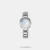 A refreshing fusion of modern elegance and soft femininity, this timepiece stands out with Its delicate petal-shaped detailing on the dial and a glossy silver finish. The radial texture and soft pastel hue offer a serene aesthetic, while the polished metal strap adds a hint of urban sophistication. Designed for girls who appreciate subtle artistry with a contemporary edge, this watch brings charm and versatility to everyday style.