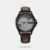 Make a bold impression with this sophisticated watch. The round dial features a classic 3-hand movement, with stick indices, along with a convenient date window. Designed for both style and durability, the watch offers water resistance up to 50 meters and is equipped with a robust leather strap, secured with a tang buckle closure for a comfortable fit.