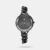 A classy look in a contemporary frame is what perfectly defines this women's analog watch from the Glitch collection by Fastrack. Its brass strap exudes a black hue that elevates the look of the watch. Housed in a 33.5 mm case, the black round dial is protected by a mineral glass. It showcases plain three hands and a crown for time adjustment. Furthermore, it is complemented with a jewellery clasp that ensures a secure fit on the wrist.