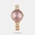 Amaze everyone around you by wearing this women's analog watch from the raga showstopper collection by Titan. The pink round dial is protected by a mineral glass. It features Plain 3-Hand and a crown for time adjustment. The metal strap comes in a rose gold hue that further elevates the look of the timekeeper. Besides, it is completed with a jewellery clasp clasp to ensure a secure fit on the wrist.