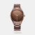 A classy look in a contemporary frame is what perfectly defines this men's analog watch from the Style Up collection by Fastrack. Its stainless steel bracelet exudes a brown hue that elevates the look of the watch. Housed in a 48.3 mm case, the brown round dial looks quite attractive. It showcases plain three hands and a crown for time adjustment.