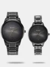 https://watchpalace.in/product/titan-black-and-gold-silver-dial-analog-with-day-and-date-stainless-steel-strap-watch-for-men-ns1805ym01/ Flaunt a stylish look with this gold stainless steel strap analog watch from the Classique collection by Titan for men. It comes with a bracelet band style and a push-button clasp that is sure to look stylish on your wrists. It has a multifunction feature along with European numbers and stick dial type. This watch is equipped with a sword needle and a silver round dial shape of 42 mm diameter, which adds to its utility. The quartz movement and analog display accentuate its features. Moreover, it is water-resistant up to 50 m and has a day and date calendar type, making it a must-have.