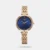 Amaze everyone around you by wearing this women's analog watch from the raga showstopper collection by Titan. The blue round dial is protected by a mineral glass. It features plain 3-hand and a crown for time adjustment. The metal strap comes in a rose gold hue that further elevates the look of the timekeeper. Besides, it is completed with a jewellery clasp clasp to ensure a secure fit on the wrist.