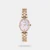 The Timex TWEL27200 is an elegant women's dress watch featuring a compact 23mm oval brass case, an iridescent mother-of-pearl dial, and a rose gold-toned jewelry bracelet, all powered by a reliable quartz movement.