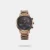 The Fastrack Tick Tock (3287KM07) is a bold, casual men's watch featuring a multi-layered black dial with rose-gold accents, a durable brass case, and a distinctive brown stainless steel strap. It offers high functionality with three multifunction subdials (day, date, 24-hour time) and 50-metre water resistance, making it a stylish and reliable choice for daily wear.