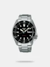 Discover Seiko watch for men, featuring a blue dial, a silver strap made of stainless steel in a round case. Built with hardlex and stainless steel body to balance clarity and durability. Dimensions include 38 mm dial size, 11 - 20 mm strap width, 10 - 14 mm profile for comfortable wear. Key features: automatic movement, analog display, 10 atm water resistance. A secure foldover clasp ensures a dependable fit.