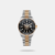 The Tornado Lumina T22001-KBKB is a 42mm men's dress-sport watch. It pairs a grey stainless steel case with a two-tone rose gold presidential bracelet.Key features include a scratch-resistant black ceramic bezel, sapphire-coated crystal, and a luminous black dial with a magnified date window. It runs on a Japanese quartz movement and offers 100m water resistance.