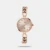 An elegant, bracelet-style Timex Fria  TWEL23803  women's fashion watch. It features a 30mm round rose gold dial, a matching brass case, and an interlinked metal chain strap with a jewelry clasp. Powered by a 3-hand quartz movement, it offers 3 ATM water resistance and is backed by a 1-year warrant