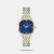 The Timex TWEL27301 is a classic women's analog dress watch featuring a distinctive 29mm cushion-shaped blue dial, a durable two-tone brass case, and a matching stainless steel strap with a secure push-button clasp. Powered by a reliable quartz movement and water-resistant up to 30 metres, it offers a perfect blend of modern edge and vintage elegance for both daily wear and formal occasions.