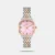 Discover Timex watch for women, featuring a pink dial, a dual tone strap made of stainless steel in a cushion case. Built with mineral and brass body to balance clarity and durability. Dimensions include 29.4 mm dial size, 11 - 20 mm strap width, 6 - 9 mm profile for comfortable wear. Key features: quartz movement, analog display, 3 atm water resistance. A secure foldover clasp ensures a dependable fit.
