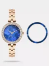 https://watchpalace.in/product/trendline-women-quartz-dial-analog-stainless-steel-watch-twtl12310/ The Timex Trendline TWTL12310 is an elegant women's analog watch featuring a classic 32mm round blue dial housed in a durable brass case. It comes styled with a sophisticated 14mm rose gold stainless steel mesh strap secured by a push-button clasp. Powered by a precise quartz movement and protected by mineral glass, this timepiece offers 3 ATM water resistance, making it both a stylish and durable accessory for everyday wear.