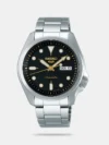 SEIKO’s longstanding tradition of crafting robust, reliable timepieces is evident in this automatic model. With over a century of watchmaking expertise, the brand has built a reputation for mechanical precision and durability. This watch from the popular sports-inspired range offers everyday versatility and clean, no-fuss design. A classic round case in stainless steel paired with a dark leather strap gives it a subtle edge, ideal for casual and semi-formal wear. It captures the essence of SEIKO’s approach to timekeeping: efficient mechanics with a touch of effortless style. The black dial presents a neat arrangement of luminous markers and hands, with a day-date window neatly placed at 3 o’clock. Powered by SEIKO’s automatic movement, it doesn’t require a battery and instead draws energy from wrist motion. The sturdy 43 mm case is water-resistant up to 100 metres, making it reliable for daily use and brief swims. The push-button deployment clasp ensures secure wear, while the leather strap offers all-day comfort. The transparent caseback reveals the automatic movement, adding visual interest. This watch is built for men who want functionality without compromising on elegance. Its classic colour scheme and mechanical soul make it a fitting choice for those who appreciate timeless engineering.